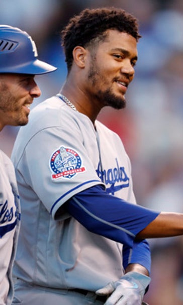 Santana picks up win in debut, Dodgers beat Rockies 11-8